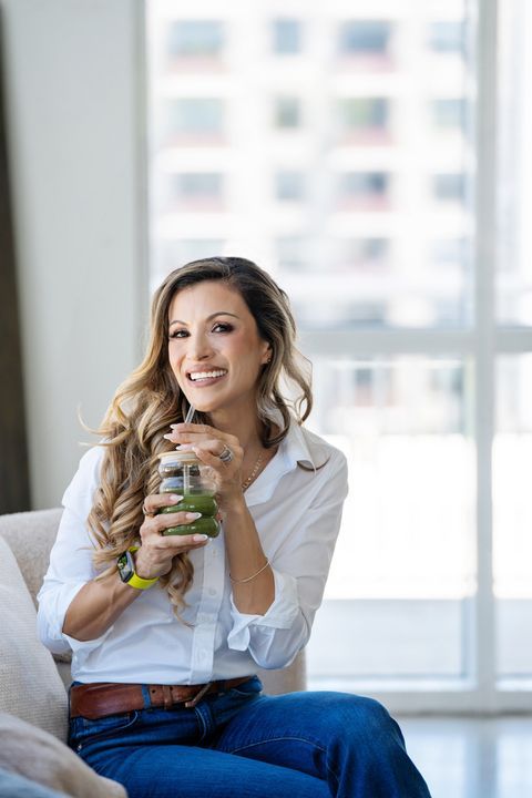 Cici holding a green smoothie